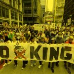 Mass protest against Trump’s authoritarianism with “No Kings” banner, rejecting monarchical power and defending U.S. democracy.